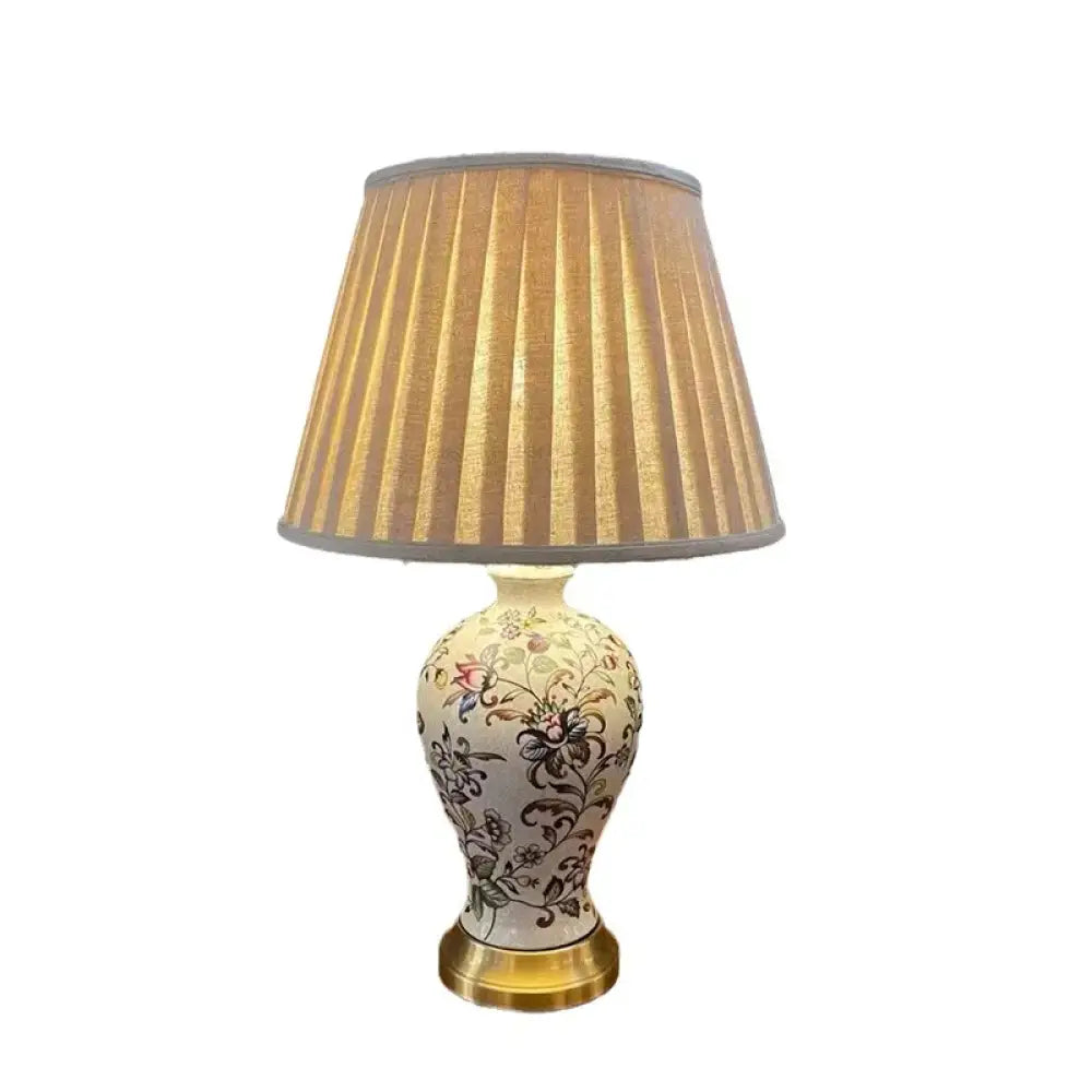 Floral ceramic LED table lamp with pleated beige shade and gold base