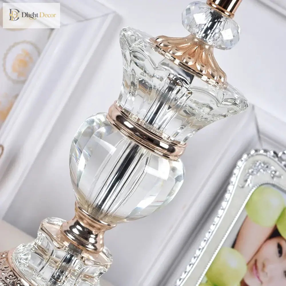 Close-up of a crystal lamp base with polished gold accents