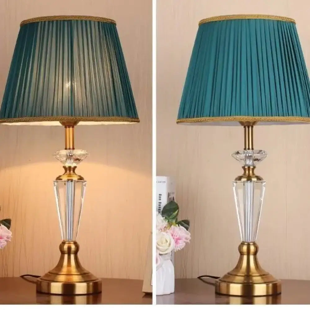 Teal pleated LED table lamps with gold bases and clear crystal columns, two angles