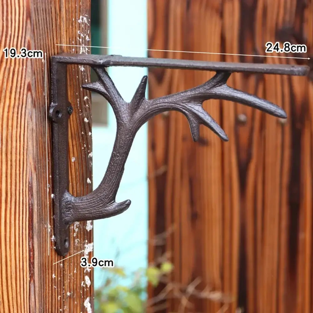 Retro iron triangle shelf bracket with size markings, dark metal, wall-mounted corner support