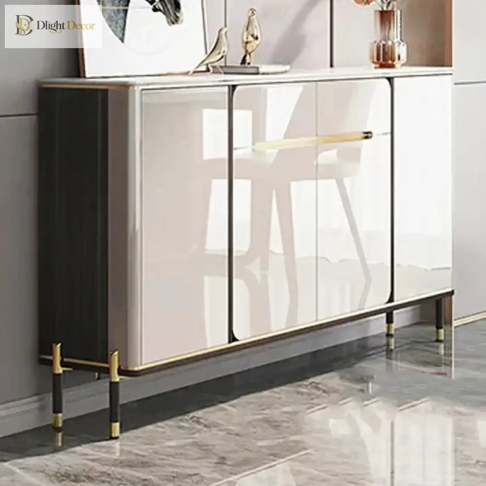 Set of 2 furniture legs with gold accents and black posts under a cabinet