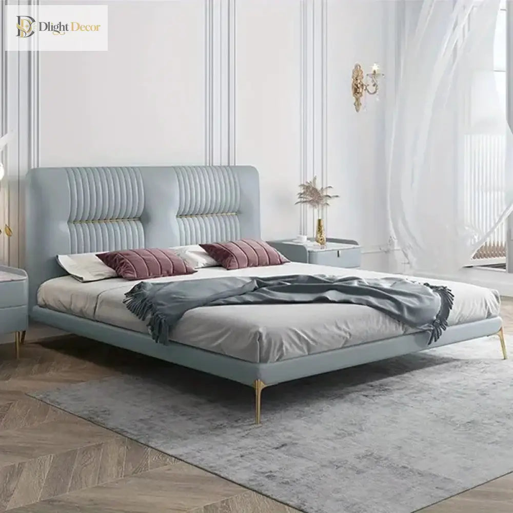 Gold stainless steel furniture legs with rubber protectors supporting a upholstered bed