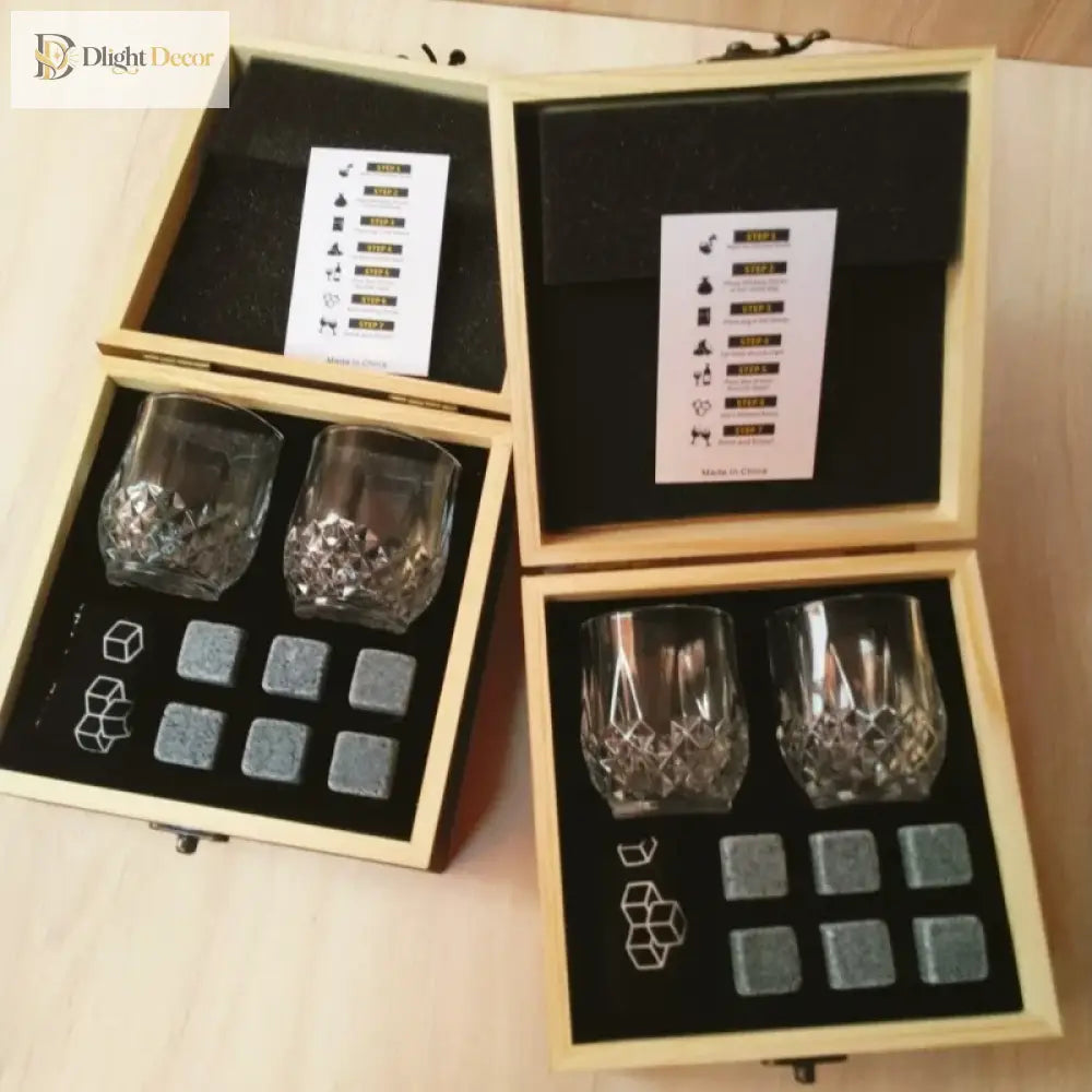 Whiskey rocks and two faceted tumblers in a divided wooden box