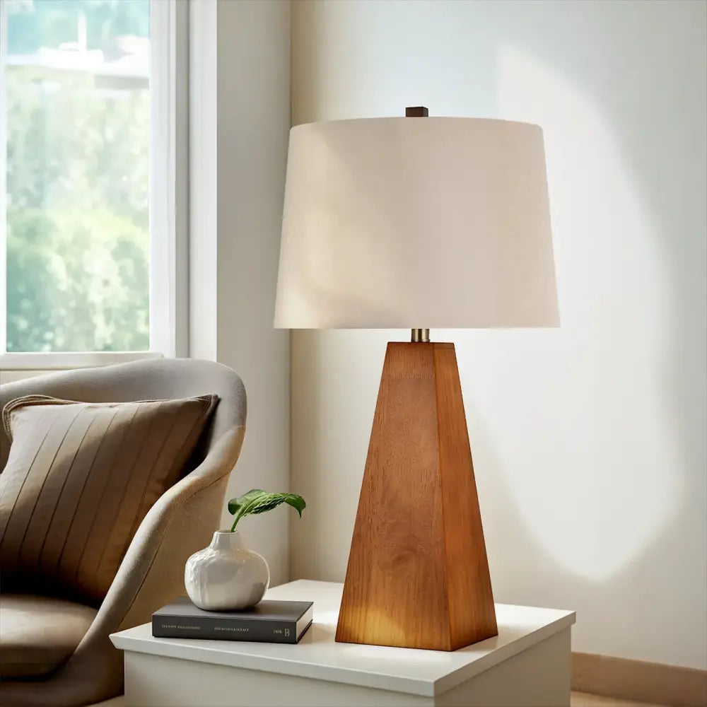 Wooden LED desk lamp with beige fabric shade and tapered brown wood base