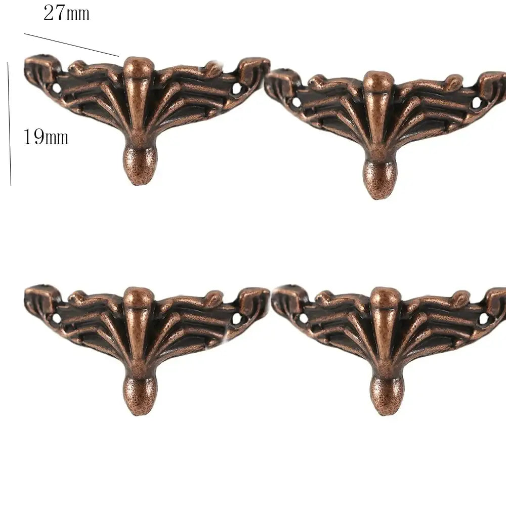 Set of four bronze corner feet with carved fan design and mounting hole areas