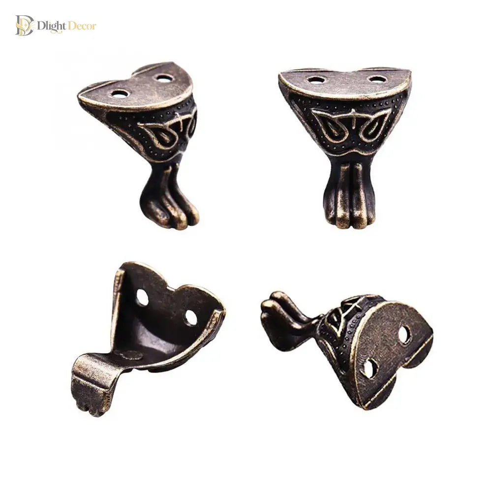 Bronze-toned corner feet with black finish and oval screw holes on mounts