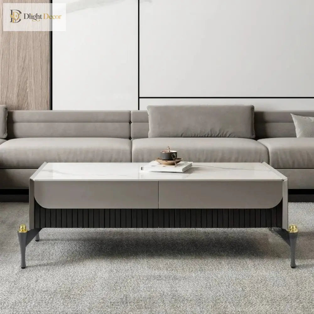 Grey sofa with two-tone metal legs, dark finish and gold accent tips