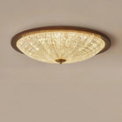 Walnut round flush-mount ceiling light with faceted clear acrylic globe diffuser