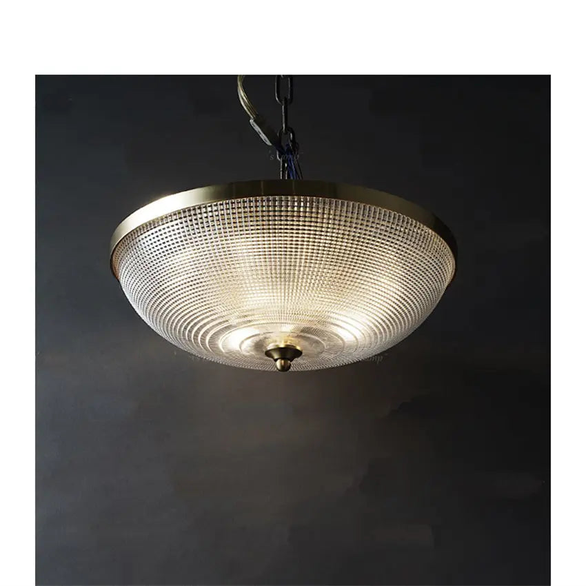 Round flush-mount ceiling light with clear lattice glass shade and gold canopy