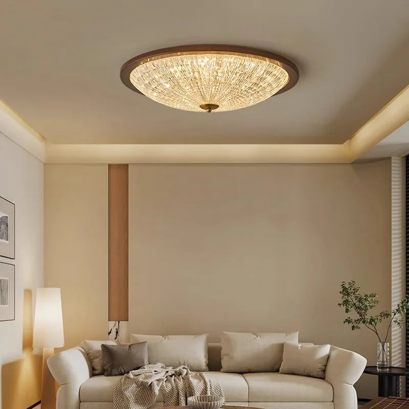 Walnut flush-mount ceiling light with clear ribbed acrylic diffuser above a sofa