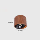 Walnut wood-grain LED mini spotlight with dark lens and visible 75mm x 55mm size marks