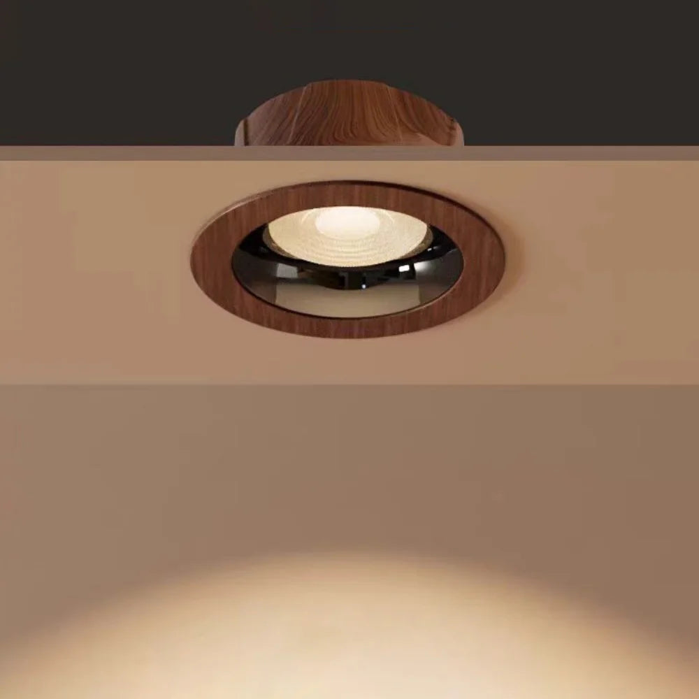 Walnut wood-grain LED ceiling spotlight with circular trim and visible glowing lamp