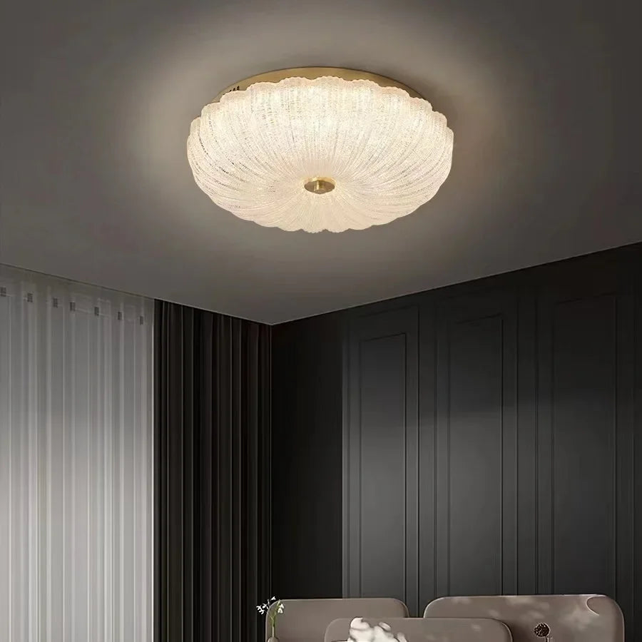 Small round crystal-style acrylic LED flush-mount ceiling light with brass center