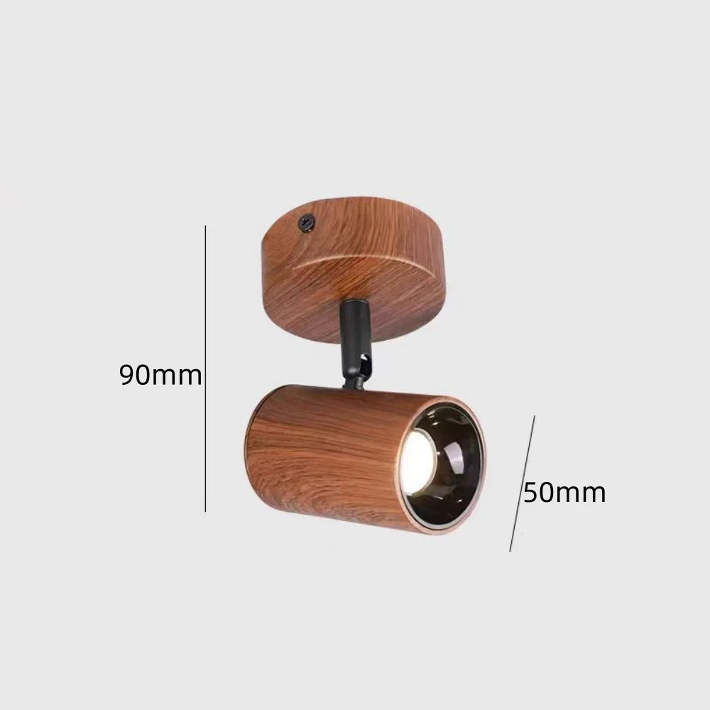 Adjustable wood-grain LED ceiling spotlight with black lamp housing and dark lens ring