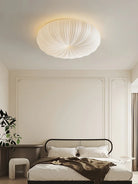 Cream fabric round ceiling light with ribbed shade, flush-mount style
