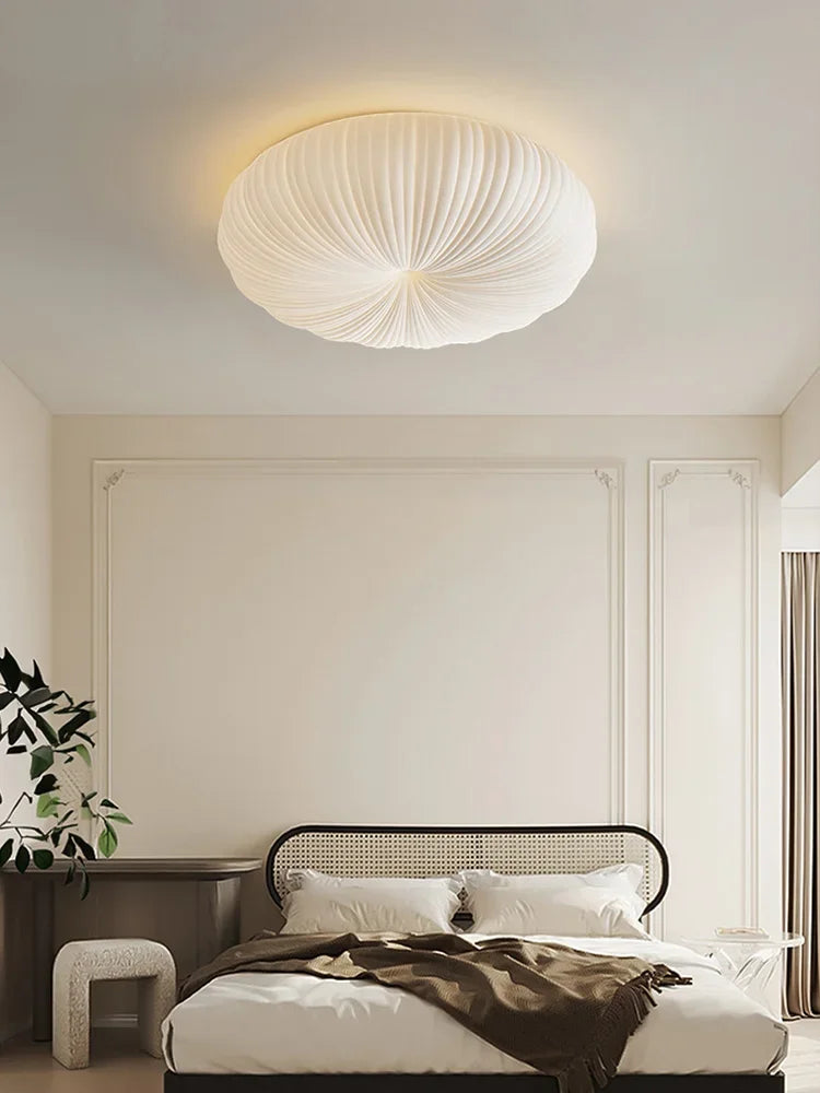 Cream fabric round ceiling light with ribbed shade, flush-mount style