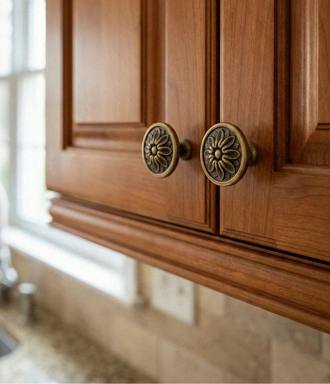 Wooden cabinet with brass flower-shaped knobs and 'Santaya' branding.