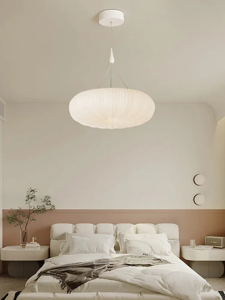 Cream fabric pendant ceiling light with ribbed globe shade and hanging cord
