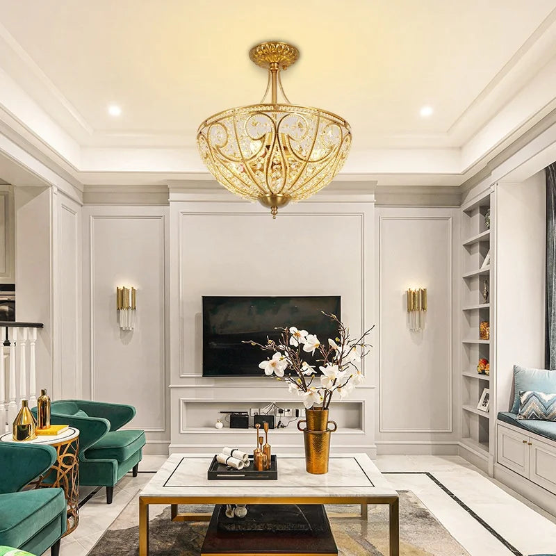 Gold-tone flush-mount chandelier with crystal-style glass panels and decorative metal frame