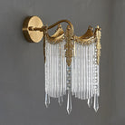 Gold crystal wall sconce with scalloped crown top and clear crystal drops