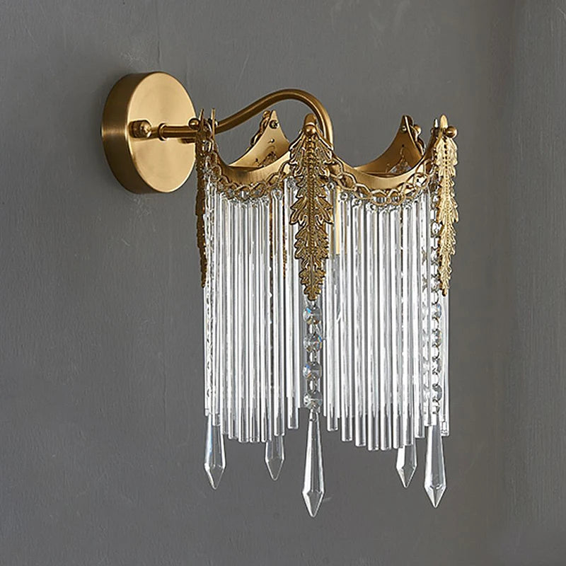 Gold crystal wall sconce with scalloped crown top and clear crystal drops