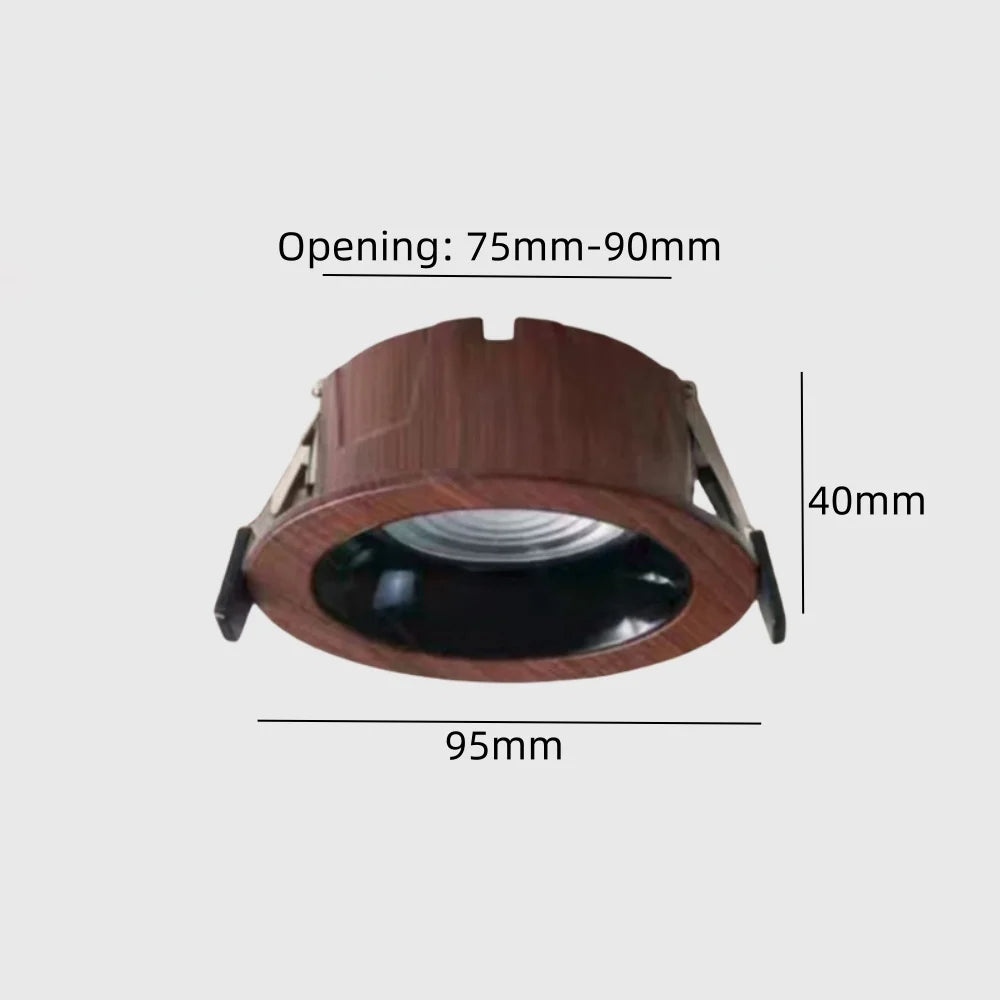 Recessed adjustable wood-grain LED spotlight with dark rim and visible lens opening
