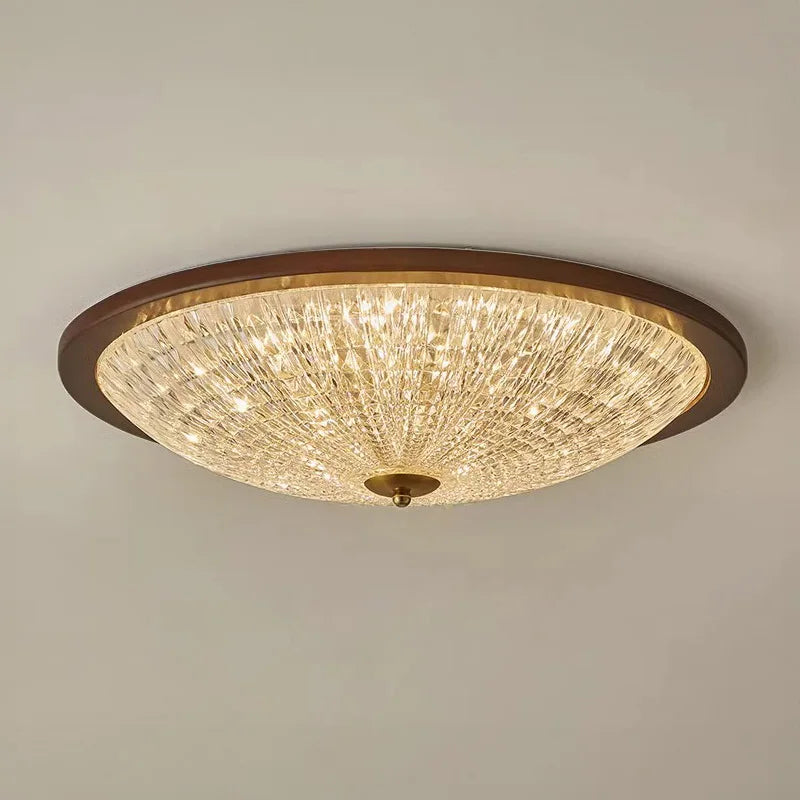 Walnut round flush-mount ceiling light with faceted clear acrylic diffuser, warm illumination