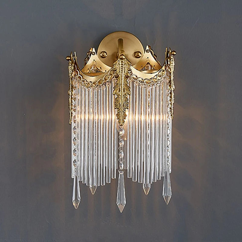Gold crystal wall sconce with arched crown top and long crystal drops