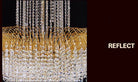 Crystal chandelier featuring hanging clear crystal fringe and gold-tone circular canopy