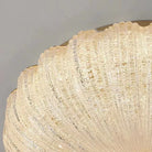 Close-up of crystal-style acrylic scalloped diffuser for an LED flush-mount ceiling light