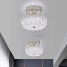 Chrome flush-mount ceiling light with clear crystal-style acrylic drum shade