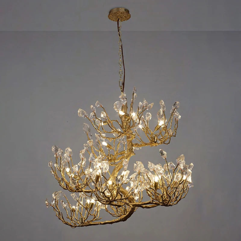 Crystal chandelier with gold-toned branch frame and hanging clear crystal prisms