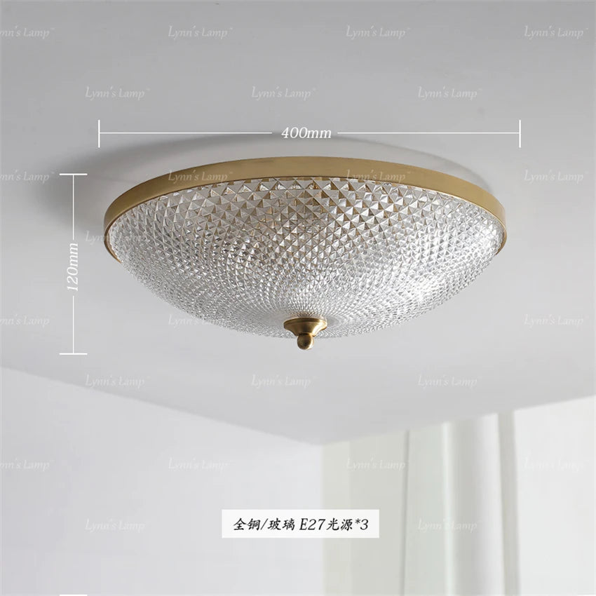 Round ceiling light with clear faceted glass shade and gold rim; 400mm shown