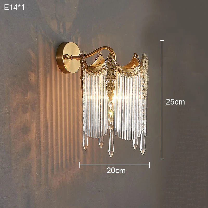 Gold crystal wall sconce, round backplate with arched crown and hanging crystal drops
