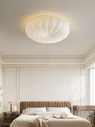 Cream flush-mount ceiling light with ribbed fabric dome shade