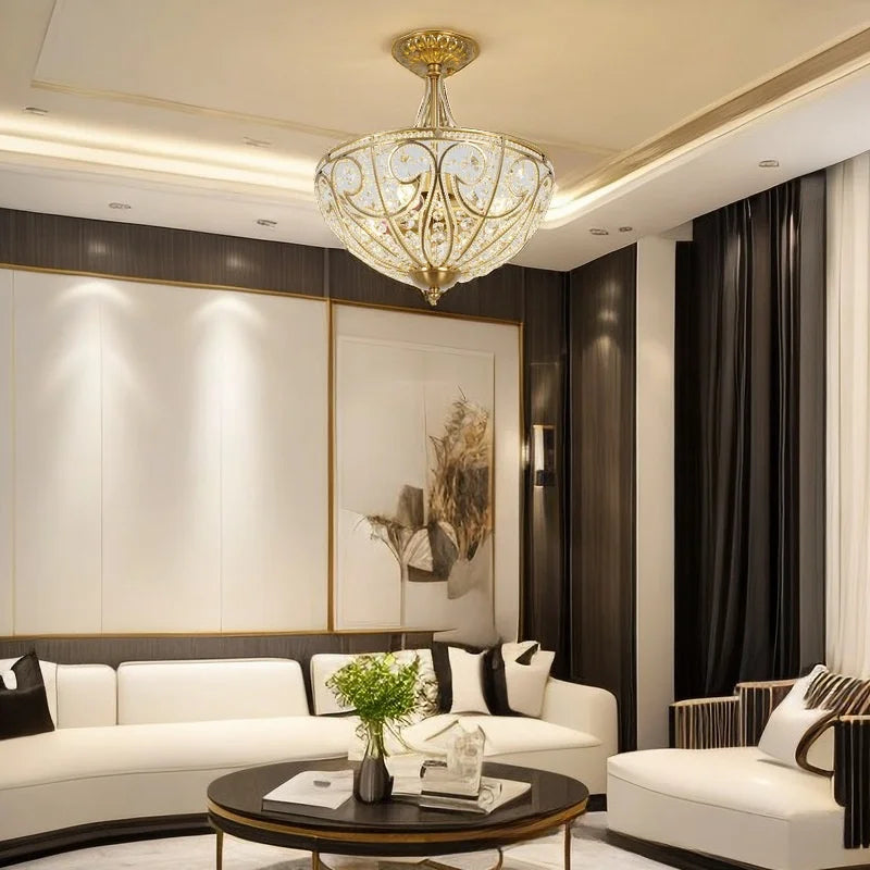 Gold-tone ornate flush-mount chandelier with crystal-style shade and decorative scrolling details