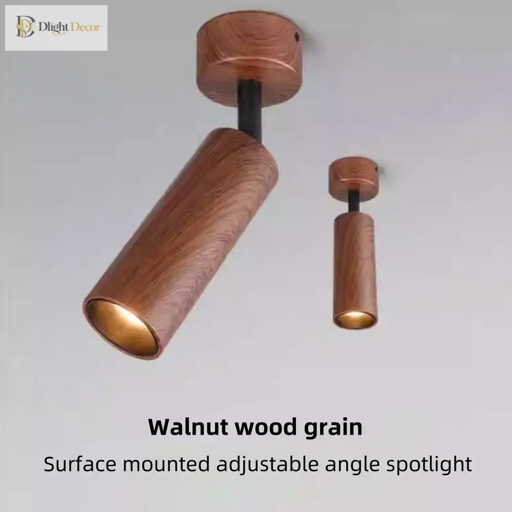 Walnut wood-grain adjustable LED spotlight, angled cylinder design with warm inner light