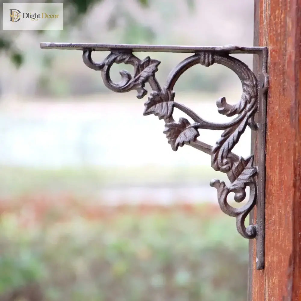 Cast iron shelf bracket underside with curved floral scrolls and leaf ornaments