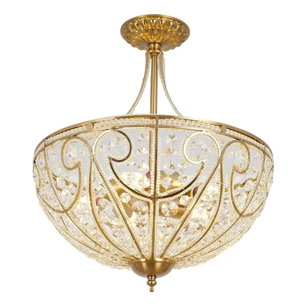 Gold-tone flush-mount chandelier close-up with crystal-style cutouts and ornate filigree pattern