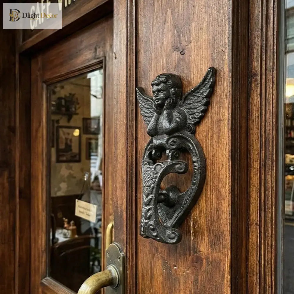Angel door knocker cast iron featuring winged cupid and a heart knocker plate, dark finish