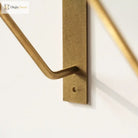 Antique brass triangle shelf bracket arm with rounded hook and mounting hole