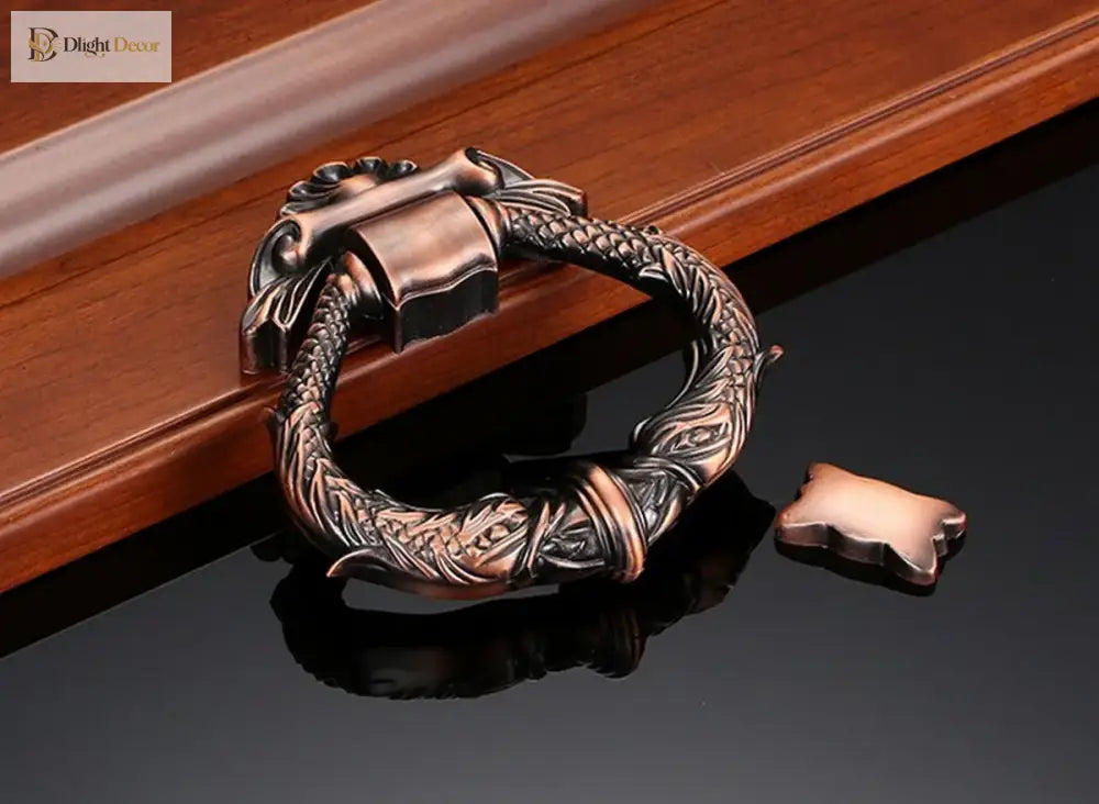 Antique bronze zinc alloy door knocker with decorative wreath ring and sculpted striker