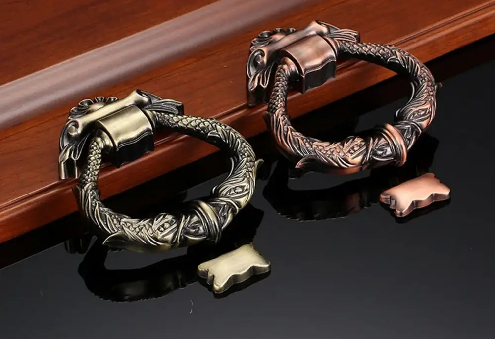 Antique zinc alloy door knocker set in antique gold and bronze, ornate wreath frame