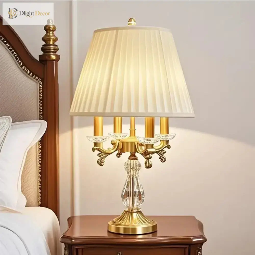 Gold art deco desk lamp with pleated shade and clear crystal centerpiece base