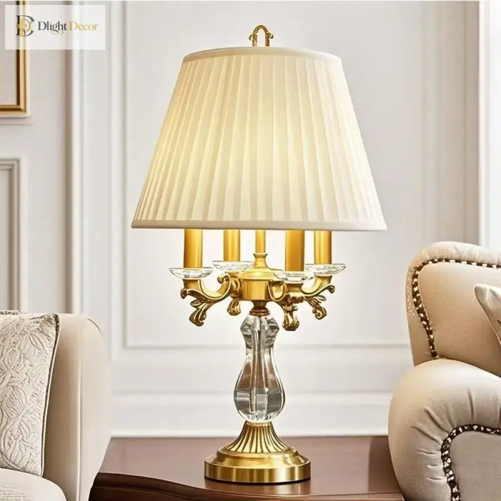 Gold art deco desk lamp with pleated cream shade and crystal column base