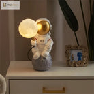 Astronaut Moon Table Lamp, a tiny spaceman a glowing moon and a whole lot of charm 🚀🌕✨ - Table Lamp