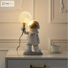 Astronaut Moon Table Lamp, a tiny spaceman a glowing moon and a whole lot of charm 🚀🌕✨ - Table Lamp