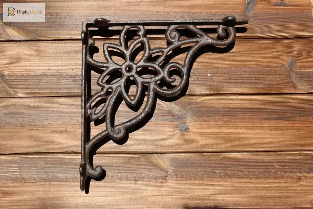 Black cast iron triangle shelf bracket with flower medallion scroll