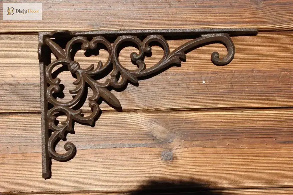 Black cast iron triangle shelf bracket with long vine scroll and corner curls