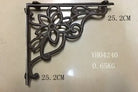 Cast iron right-angle shelf bracket with star flower scroll ornament, dark finish